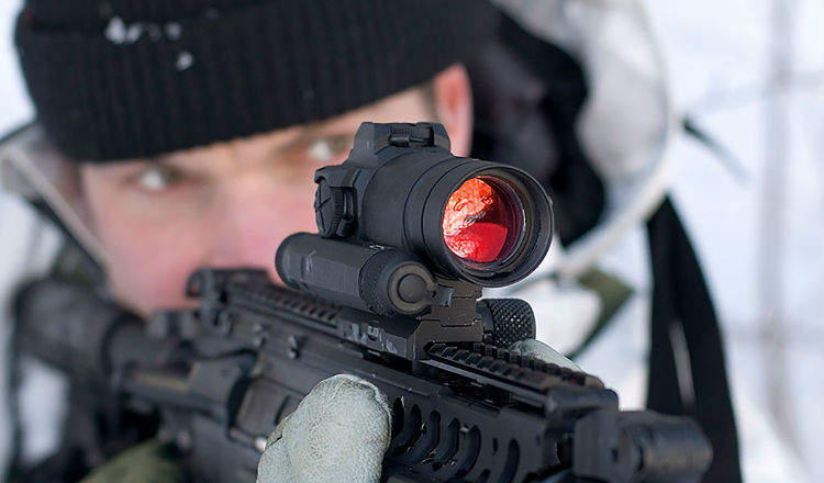 Aimpoint Compm4 sight attached to a rifle